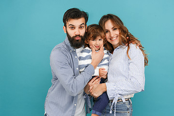 Image showing A happy family on blue background