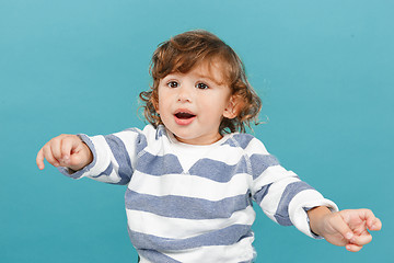 Image showing Portrait of happy joyful beautiful little boy, studio shot