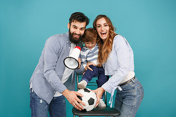 Image showing happy father and son playing together with soccer ball on white