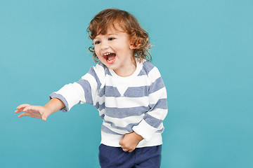 Image showing Portrait of happy joyful beautiful little boy, studio shot