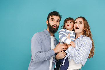 Image showing A happy family on blue background