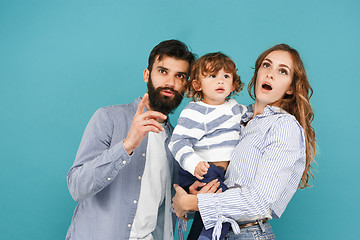 Image showing A happy family on blue background