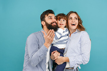 Image showing A happy family on blue background