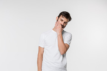 Image showing Young man is having toothache.