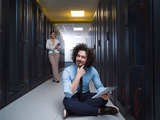 Image showing young technicians working together on servers