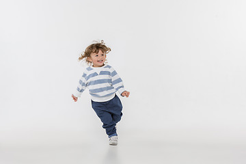 Image showing Portrait of happy joyful beautiful little boy, studio shot