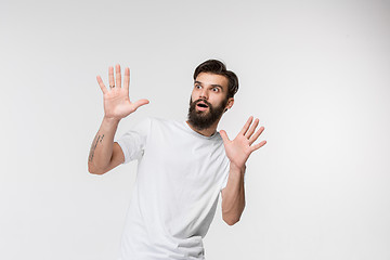 Image showing Portrait of the scared man on white