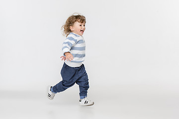 Image showing Portrait of happy joyful beautiful little boy, studio shot