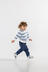 Image showing Portrait of happy joyful beautiful little boy, studio shot