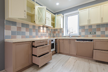 Image showing Luxury modern provence styled grey, pink and cream kitchen interior