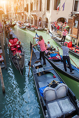 Image showing Gondolas with gondoliers in Venice