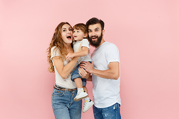 Image showing A happy family on pink background