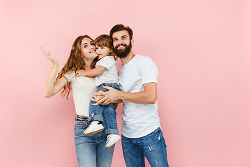 Image showing A happy family on pink background