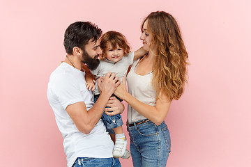 Image showing A happy family on pink background