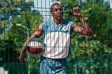 Image showing Picture of young resting african basketball player