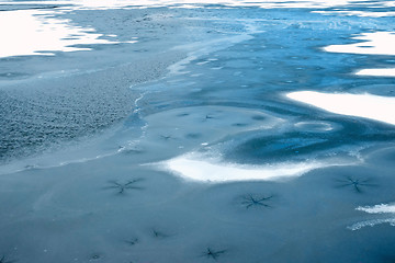 Image showing Lake frozen in early winter, blue water color