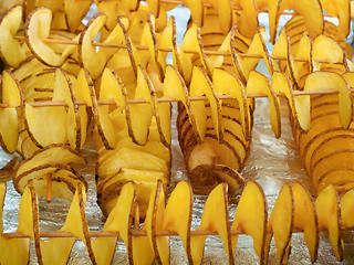 Image showing A pile of spiral potato slices