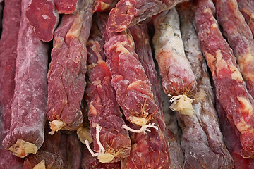 Image showing A pile of raw dried sausages