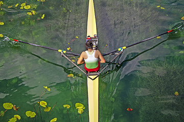 Image showing Woman Single sculls rower during the start of a rowing 