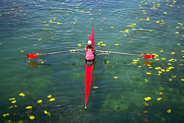 Image showing Woman Single sculls rower during the start of a rowing