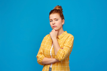 Image showing red haired teenage girl in checkered shirt