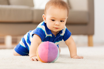 Image showing sweet little asian baby boy playing with toy ball