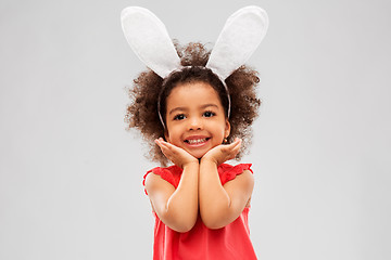 Image showing happy little girl wearing easter bunny ears posing