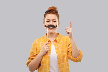 Image showing teenage girl with moustaches pointing finger up