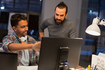 Image showing creative team with computer working late at office