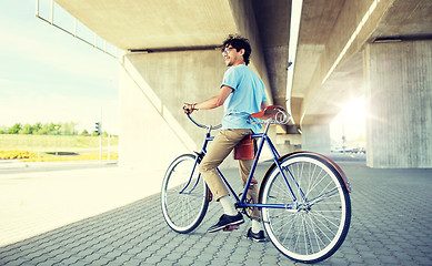 Image showing young hipster man riding fixed gear bike