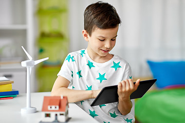 Image showing boy with tablet, toy house and wind turbine