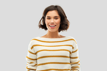 Image showing happy smiling woman in striped pullover