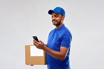 Image showing indian delivery man with smartphone and parcel box