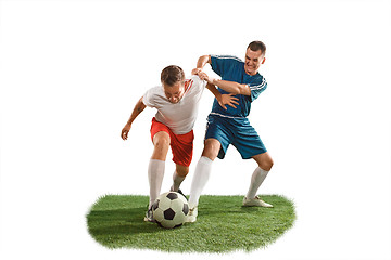 Image showing Football players tackling for the ball over white background