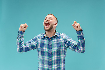 Image showing Winning success man happy ecstatic celebrating being a winner. Dynamic energetic image of male model