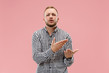 Image showing Beautiful male half-length portrait isolated on pink studio backgroud.