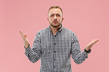 Image showing Beautiful male half-length portrait isolated on pink studio backgroud.