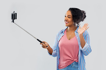 Image showing african american woman taking selfie by smartphone