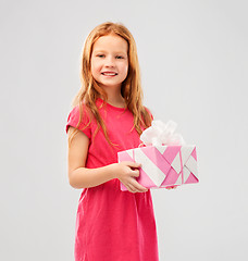 Image showing smiling red haired girl with birthday gift