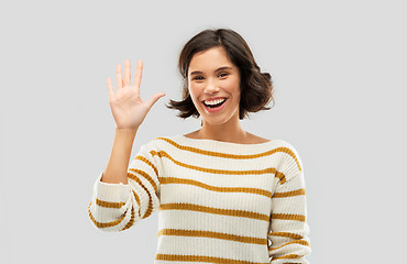 Image showing happy smiling woman showing five fingers