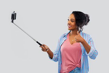 Image showing african american woman taking selfie by smartphone