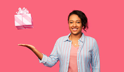 Image showing happy african american woman with birthday present