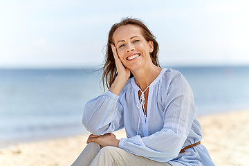 Image showing happy smiling woman on summer beach