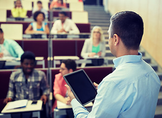 Image showing teacher with tablet pc and students at lecture