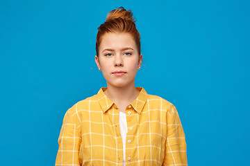 Image showing red haired teenage girl in checkered shirt