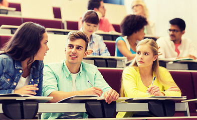 Image showing group of students with notebooks in lecture hall