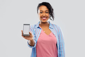 Image showing happy african american woman showing smartphone