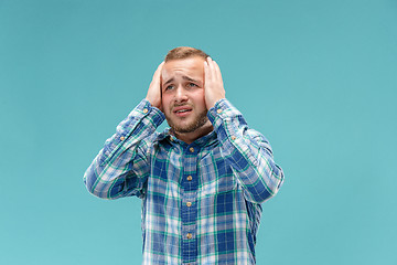 Image showing Handsome man in stress isolated on blue