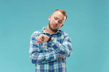 Image showing Beautiful bored man bored isolated on blue background