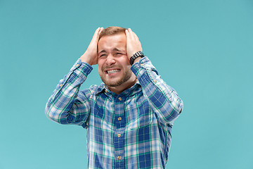 Image showing Handsome man in stress isolated on blue